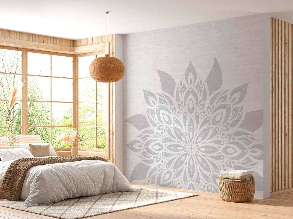 Mandala gris clair sur brique