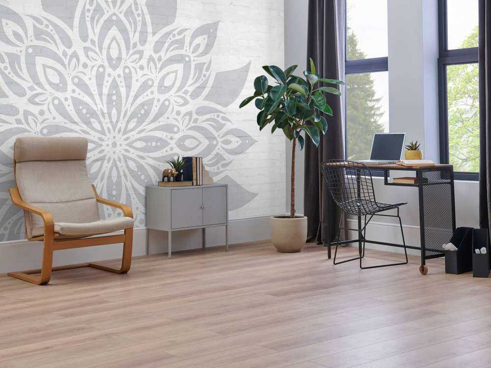 Mandala gris clair sur brique