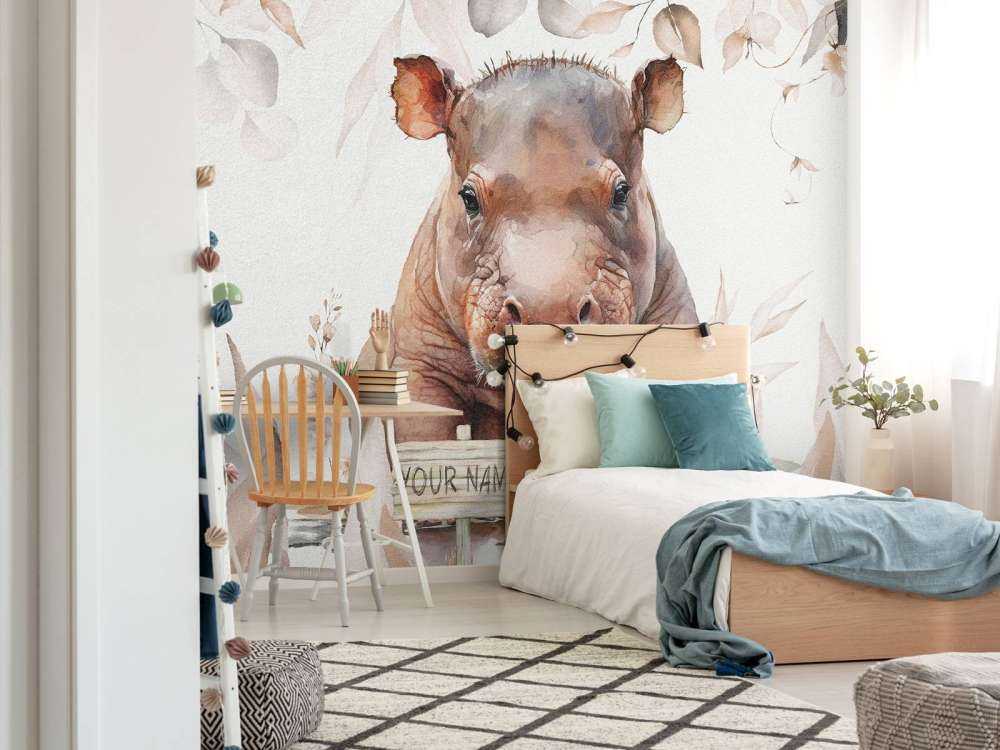 Bébé hippopotame dans les feuilles taupe