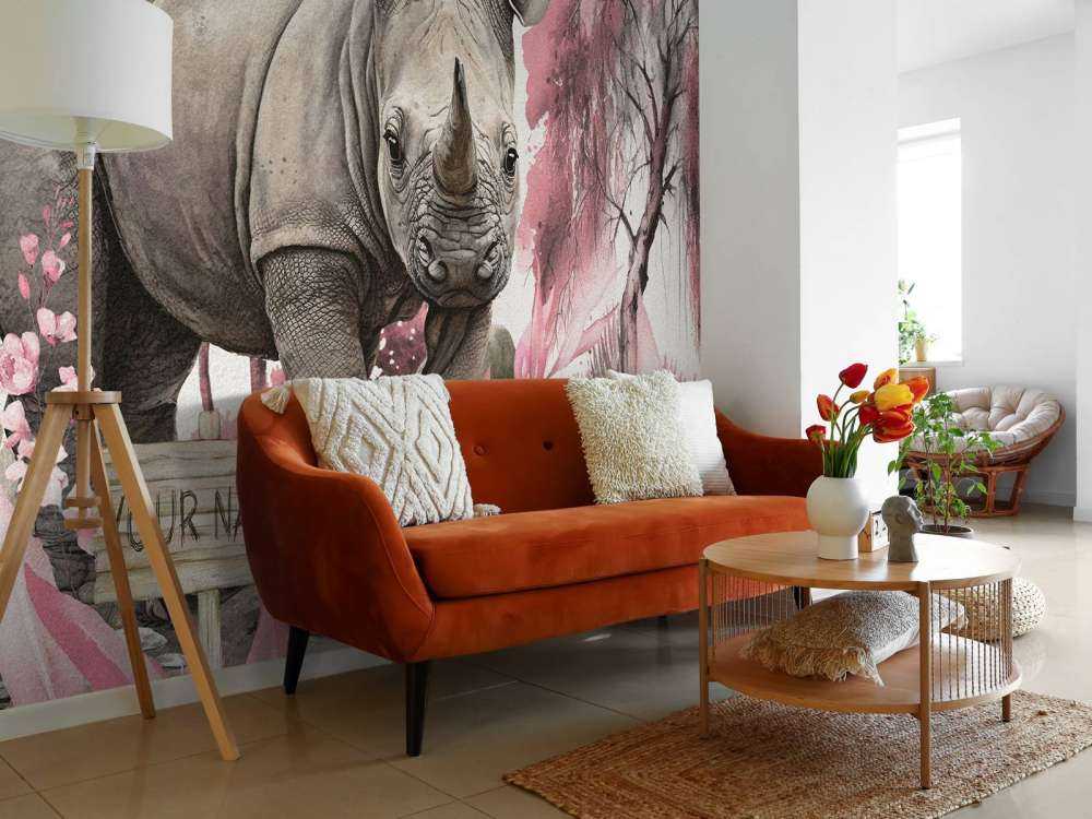 Bébé rhino dans la savane rose